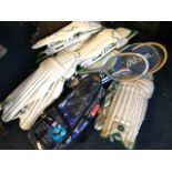 Six pairs of cricket pads; an adult bagged scuba set; and four wood tennis rackets. (11)