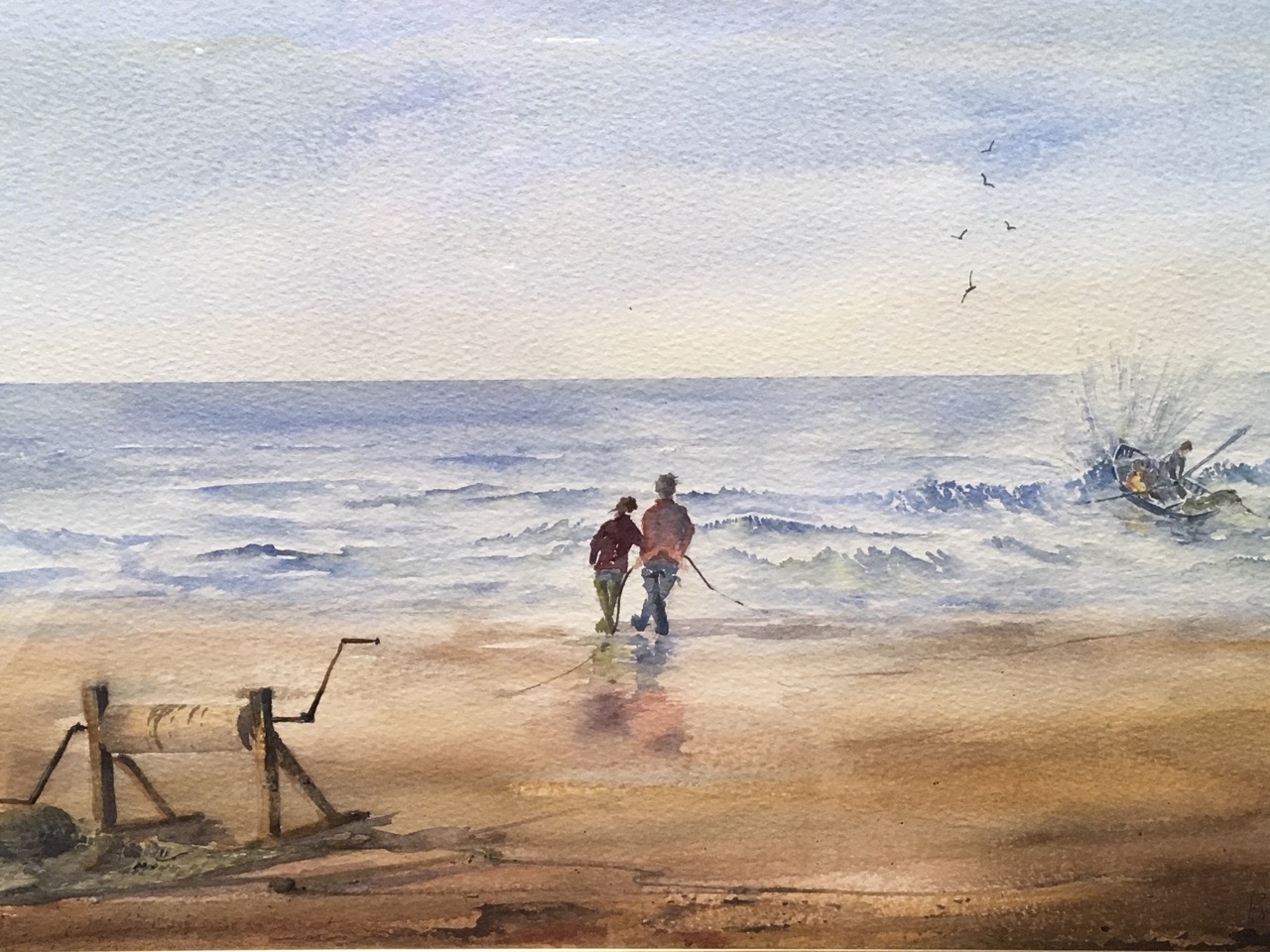 Brian J Turnbull, watercolour, figures on beach with rowing boat, signed and dated, mounted and gilt