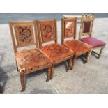 A set of three Victorian oak dining chairs with brass studded upholstered backs in channelled