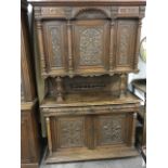 A Victorian carved oak French dresser, with moulded cornice above three cupboards with foliate