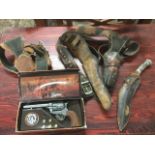 A boxed Colt 45 replica army pistol; two leather western style gun holsters with leather belts;