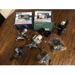 Eight miscellaneous spinning reels, some new, boxed and unused. (8)