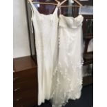 A Kelsey Rose long beaded wedding dress; and another more meringue style dress with floral lace