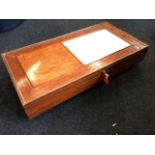 A rectangular mahogany games box, the hinged panelled top with chessboard and scoring panel, the