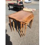 A nest of rectangular tables with scalloped tray tops on tapering legs with reeded bands. (3)