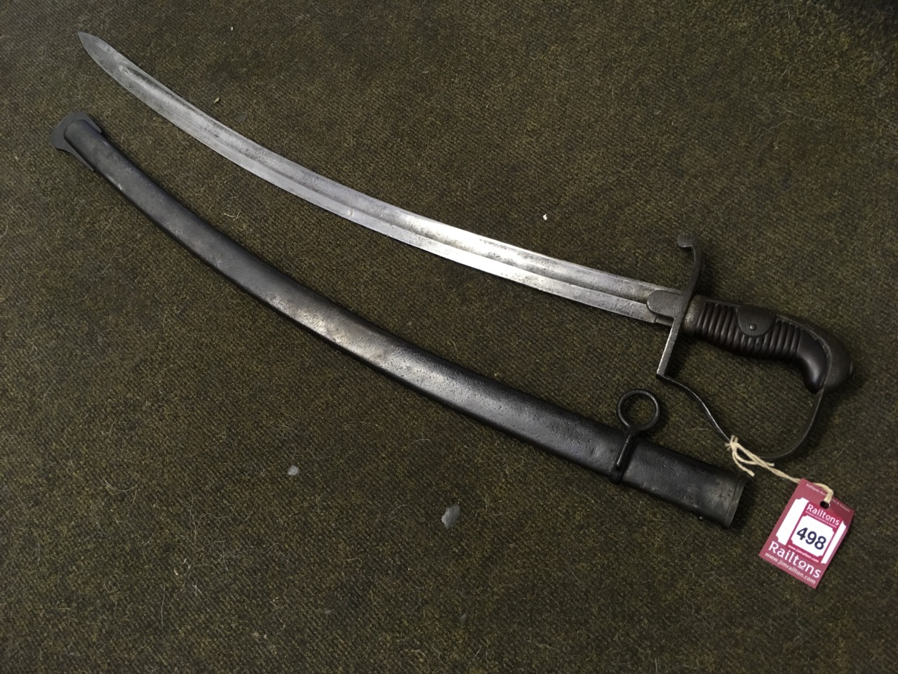 A late eighteenth century light cavalry trooper sabre with curved channelled blade, having bronze