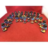 A collection of Robertsons handpainted golliwog figures, 14 band musicians and 13 footballers. (27)