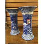 A pair of Masons blue & white waisted vases decorated with figures in classical landscapes framed by