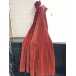 A pair of lined velvet rust/red coloured curtains. (2) (56in)