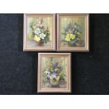 Margaret Peach, oil on canvas, a set of three still life studies of vases of flowers, signed and