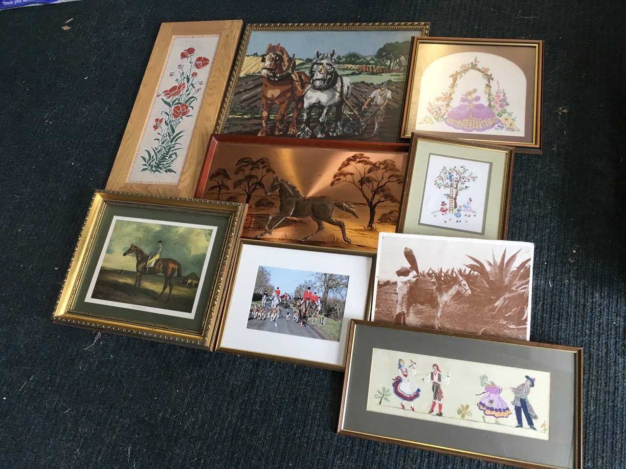 A box of framed pictures - tapestries, a tile panel, a copper horse signed Magowan, horses, etc. (