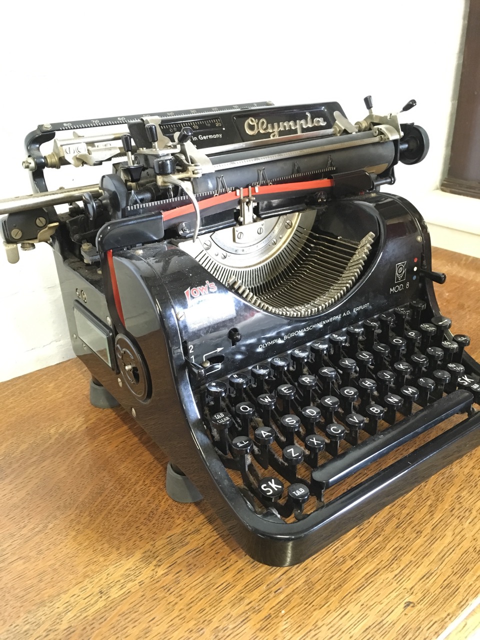 A German Olympia mechanical typewriter, the metal framed model 8 machine with Lows retail label. - Image 5 of 6