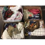 Four boxes of miscellaneous textiles including lace, embroidery, tablecloths, damask, silk