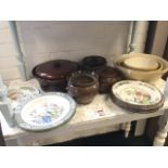 A set of four graduated salt glazed kitchen mixing bowls; four other stoneware cooking pots &