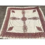 An embroidered wool shawl, the square with central floral star medallion and scrolled cross within a