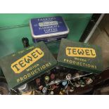 Three tins - two Tewel motor parts tins containing buttons, belt buckles, etc.; and a Harrogate