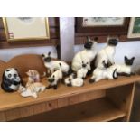 Six Royal Doulton siamese cats; two other similar cats by Beswick; two resin cat models; and a