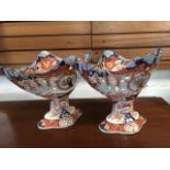 A pair of large Imari style vases, with diamond lozenge boat shaped bowls with scalloped rims and