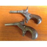 A matched pair of pocket pistols, the nineteenth century pin-fire guns with tapering numbered