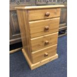 A small pine chest of four graduated drawers mounted with knobs, supported on a moulded plinth.