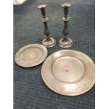 A pair of nineteenth century pewter baluster bead moulded candlesticks with ejector rods; a 13.