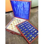A cased carved marble chess set with complete set of pieces, the board A/F. (A lot)