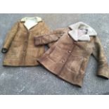 Two classic sheepskin coats or jackets, each with leather buttons. (2)