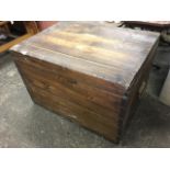 A dovetailed pine blanket box with cranked hinges, mounted with carrying handles to ends.