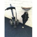 An aluminium Dunlop golf trolley; and an umbrella shooting stick with leather seat. (2)