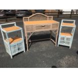 A painted cane dressing table with a pair of matching bedside cabinets, the table with frieze drawer