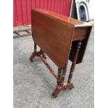 A nineteenth century mahogany sutherland table, the two drop flaps with canted corners raised on