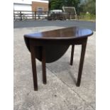 A Georgian mahogany side table with 'D' shaped top raised on square chamfered column legs, the