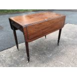 A Gillow style nineteenth century mahogany pembroke table, the rectangular top with two rounded drop