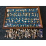 A collection of novelty spoons, mostly enamelled, EPNS, Europe & abroad, some in modern mahogany