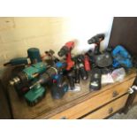 Miscellaneous power tools including drills, a cased soldering iron, a planer, sanders, electric