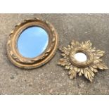 An oval mirror in ribbon moulded gilt frame with berries; and a small carved giltwood mirror with