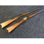 Two Winchester style fairground rifles with octagonal steel barrels and hardwood mounts. (2)