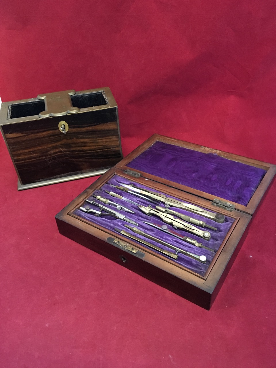 A rectangular Victorian coramodel locking tantalus type box with brass mounts; and a rosewood
