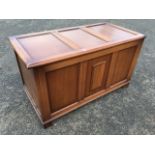 A panelled oak blanket box with moulded stiles, having applied linenfold to front.