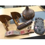 Miscellaneous items including a carved tribal face mask, a pair of corner shelves, an embroidered