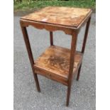 A square Georgian mahogany washstand with later top, having shaped aprons on square column legs,