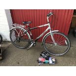 A Raleigh Pioneer Metro gents bicycle with seven speed gears, gel seat, rear carrier, stand, bell,
