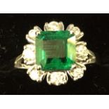 An 18ct gold Panshir emerald & diamond ring, the baguette cut emerald stone of just over one-and-a-