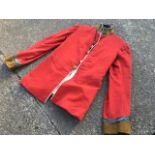 A Northumberland Fusiliers scarlet tunic, the jacket by T White & Co, Military Tailors, Aldershot,