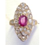 An 18ct rose gold ruby & diamond cluster ring, the oval ruby weighing a carat, mounted on an