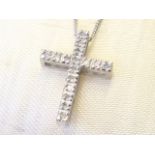 An 18ct platinum diamond crucifix, the cross set with sixteen small diamonds, mounted on a fine