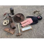Miscellaneous items including a golliwog, a brass baluster stand, a cast iron bust of Hitler,