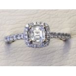 An 18ct gold diamond ring, the Asscher cut diamond weighing 0.39 of a carat, claw set above a