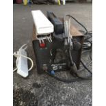 A Weldmate electric welder, complete with packs of rods, extension cable, etc. (A lot)