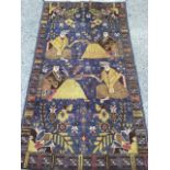 An oriental rug woven with four stylised seated figures on ink blue field framed by floral